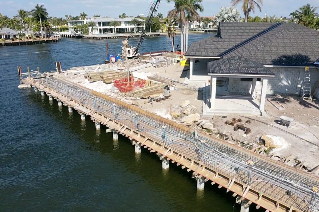 A beautiful waterfront view of 31 Fort Royal Isle, showcasing the luxurious home and surrounding landscape.