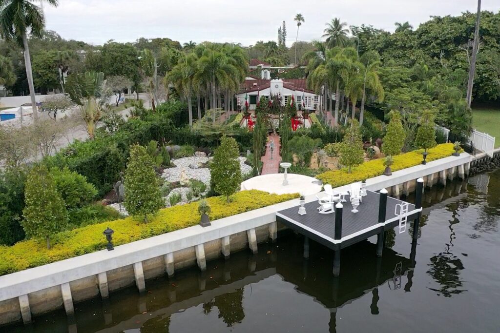 Exterior view of 416 Palm Ave8 showcasing a modern architectural design with lush landscaping.