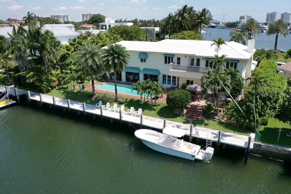 Luxurious coastal property at 81 Isla Bahia 1, showcasing modern architecture and scenic waterfront views.
