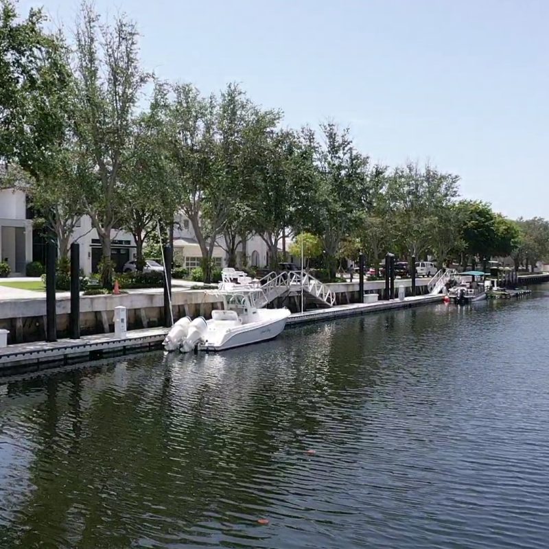 Modern residential building at 230 N. Compass 5, showcasing sleek architecture and landscaping.