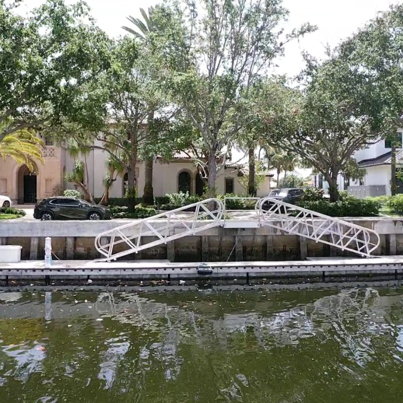 Exterior view of 230 N. Compass 6, showcasing modern architecture and surrounding landscaping.