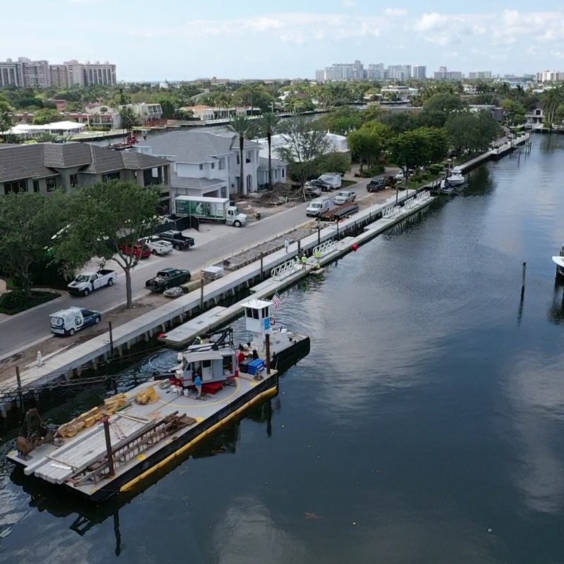 A scenic view of 230 N. Compass Barge, showcasing its unique architectural design against a clear sky.