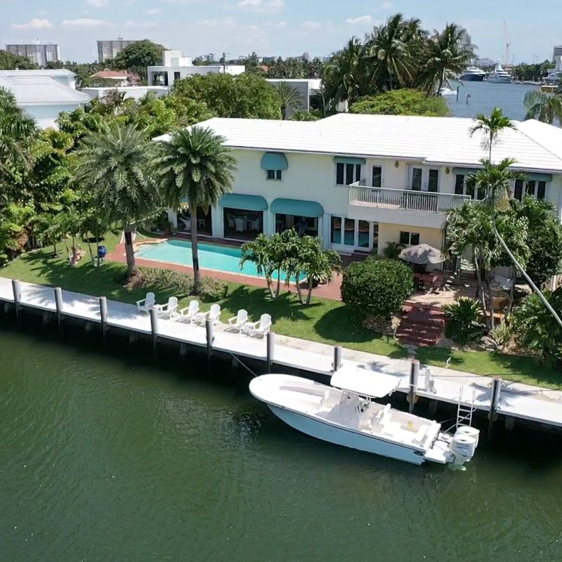 Luxurious coastal property at 81 Isla Bahia 1, showcasing modern architecture and scenic waterfront views.