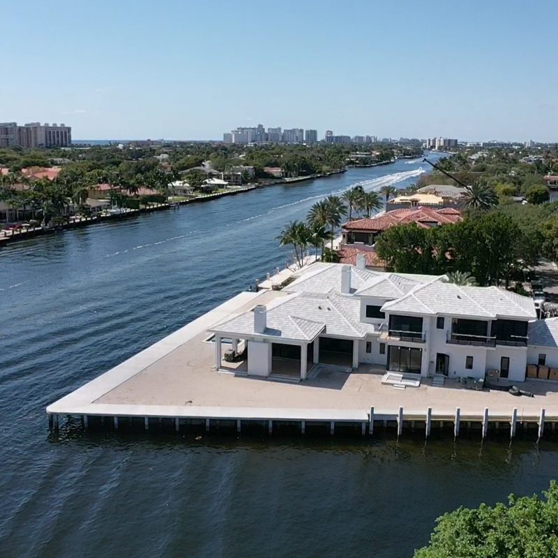 A modern dock design featuring a compass motif, ideal for waterfront properties and enhancing outdoor spaces.