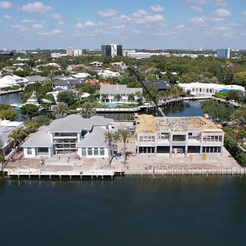 A view of the Compass Intercoastal Side 1, showcasing modern architecture and waterfront scenery.